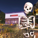 Skeleton standing in front of a virtual Chipotle in Roblox